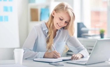 Customer reviewing moving cost estimate with professional relocation documentation